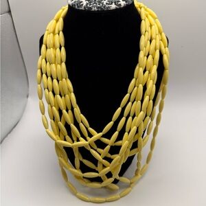 Vintage multi strand Goldtone yellow metal oval plastic bead 13” long